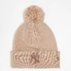 New Era NY Yankees Metallic Logo Pom Pom Beanie In Beige For Unisex
